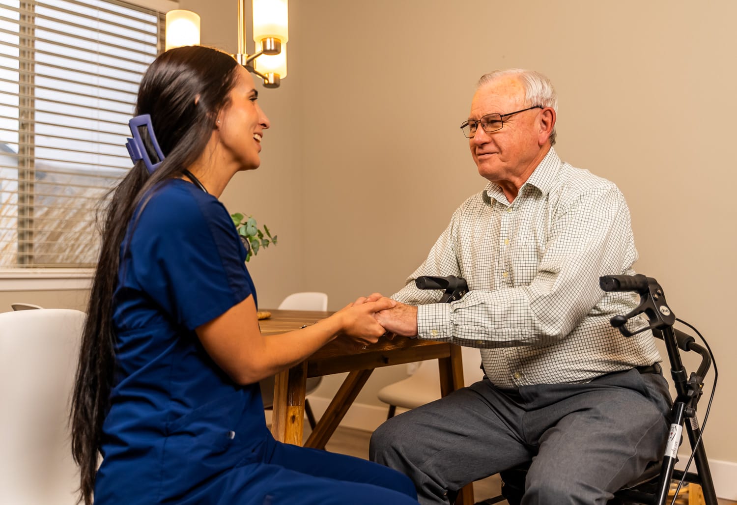 Hanford Home Health_Website Shoot_02.2025-00319 nurse and patient sitting at a kitchen table together