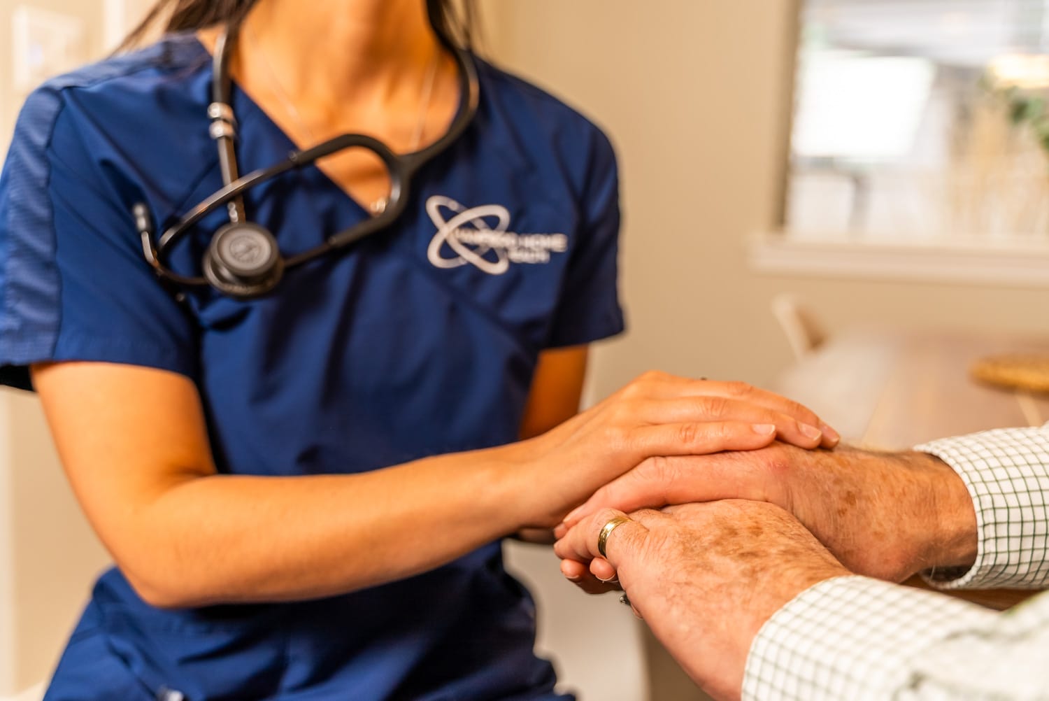 Hanford Home Health_Website Shoot_02.2025-00327 nurse comforting a patient