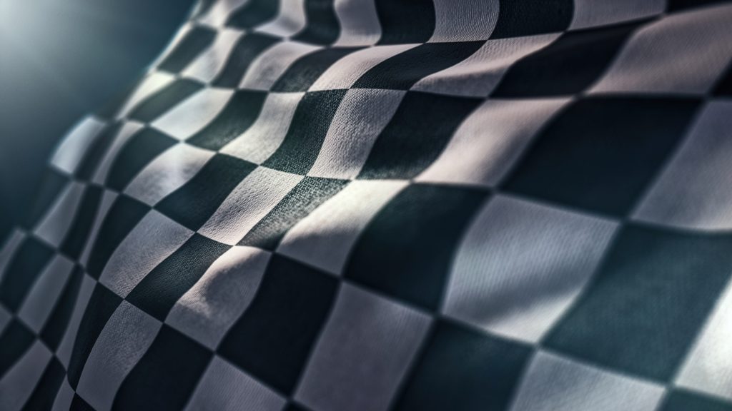 waving racing finish flag in motion background