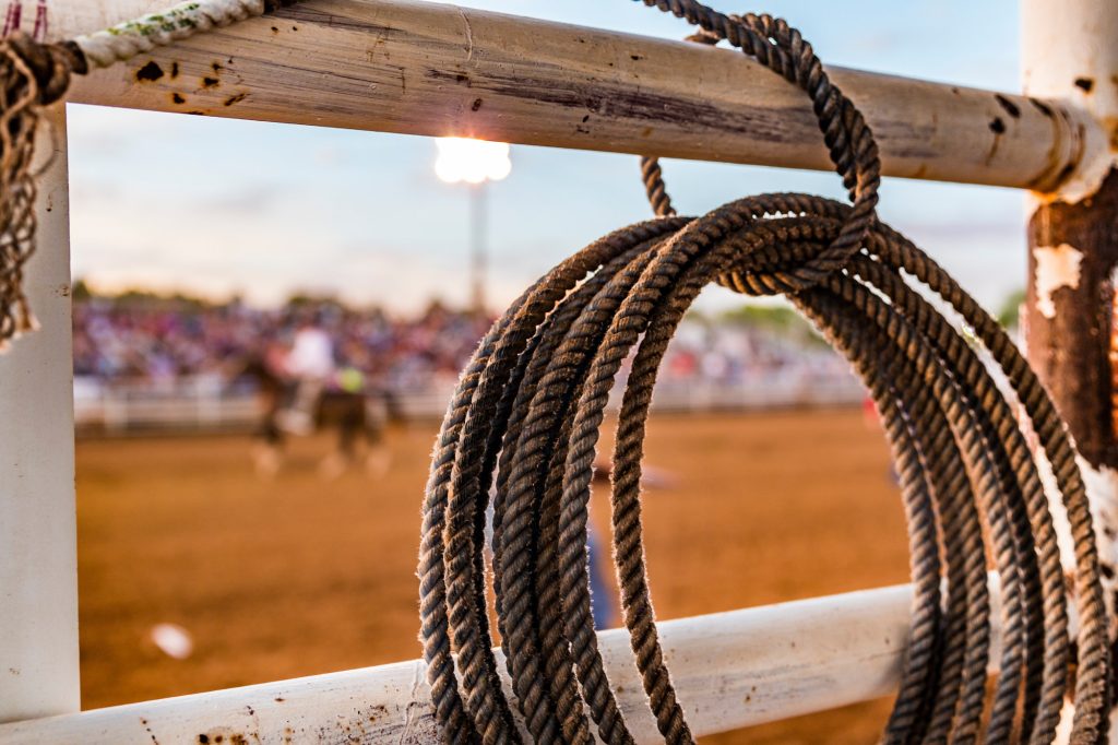 rope tied to a fence at a rodeo