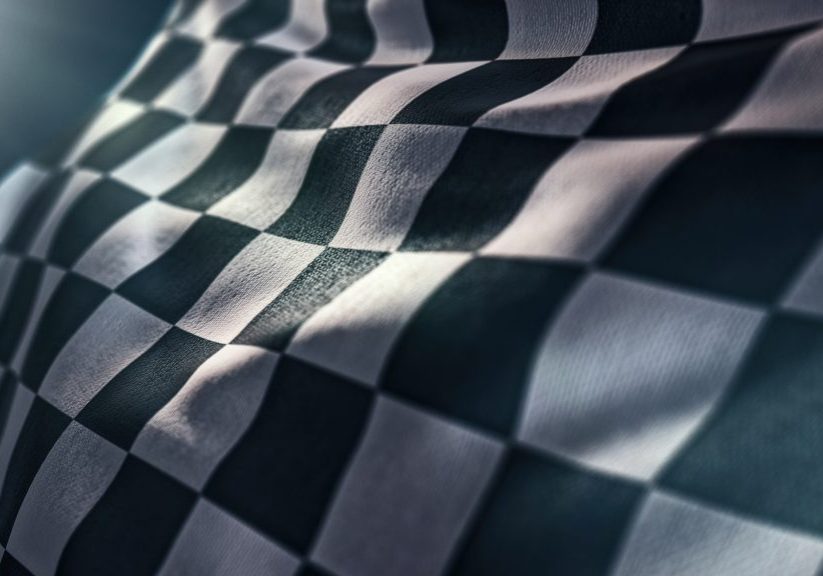 waving racing finish flag in motion background