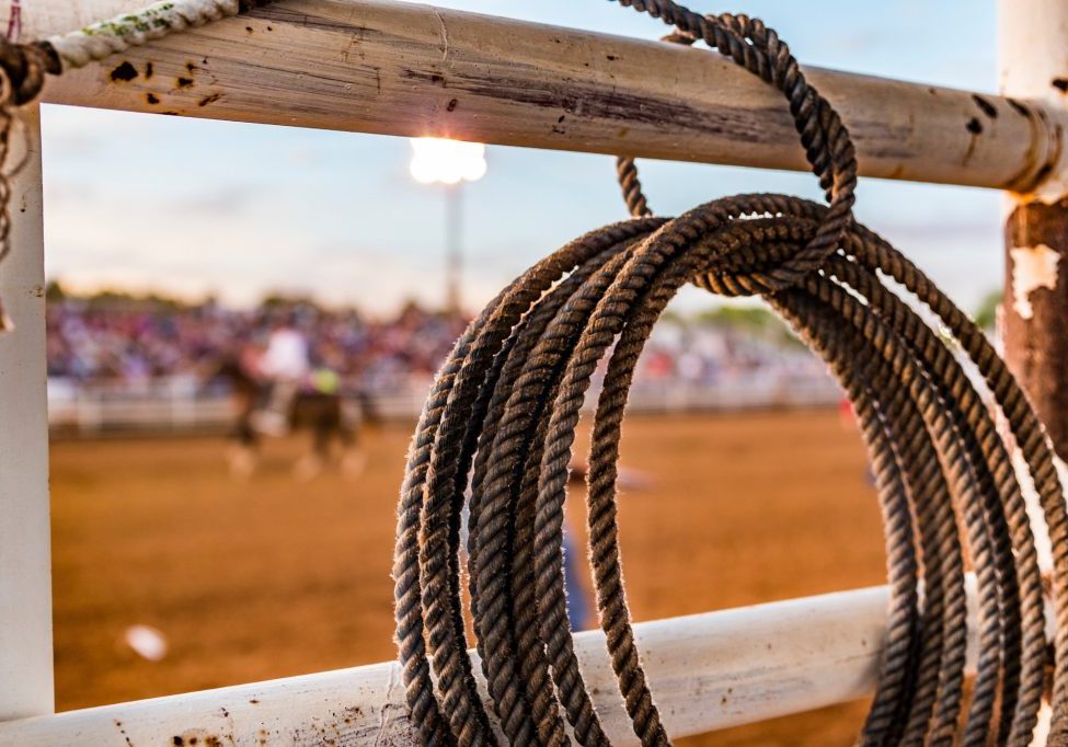 rope tied to a fence at a rodeo